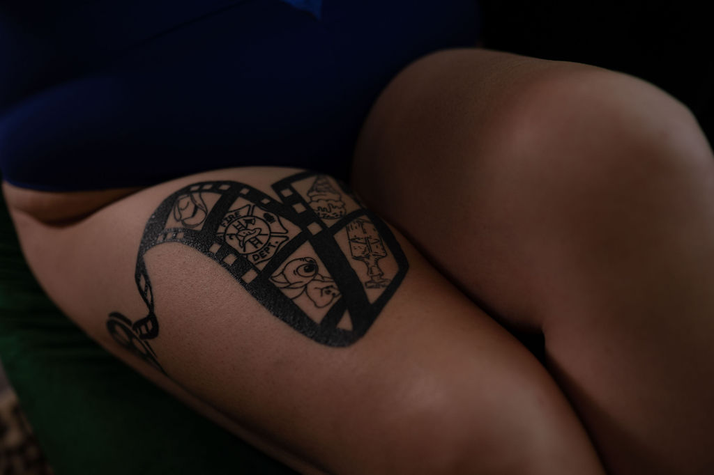 details of a woman with a large thigh tattoo